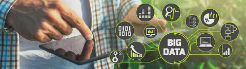 a fusão da agricultura moderna com a tecnologia de ponta. Em primeiro plano, vemos as mãos de um agricultor